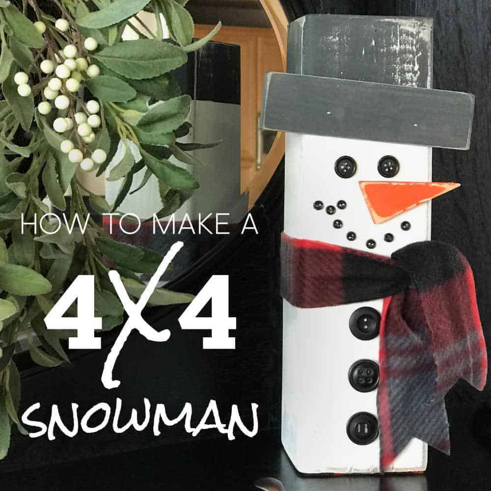 Image of a snowman made out of a 4 x 4 sitting on a shelf next to a wreath.