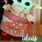 Baby Yoda in a Christmas Stocking with the words: Stocking Stuffer Ideas For Teenagers