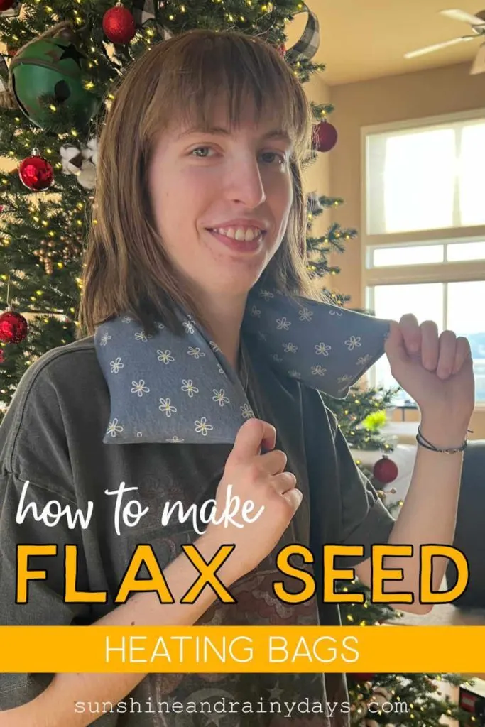 Justine standing in front of our Christmas Tree with a Flax Seed Heating Bag around her neck!