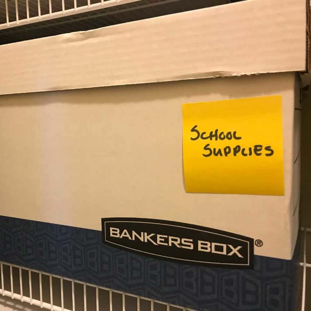 Labeled Banker's Box on a wire shelf because this is a temporary move.