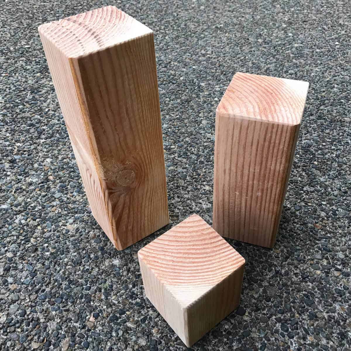 4 x 4 wood post cut in three different heights.