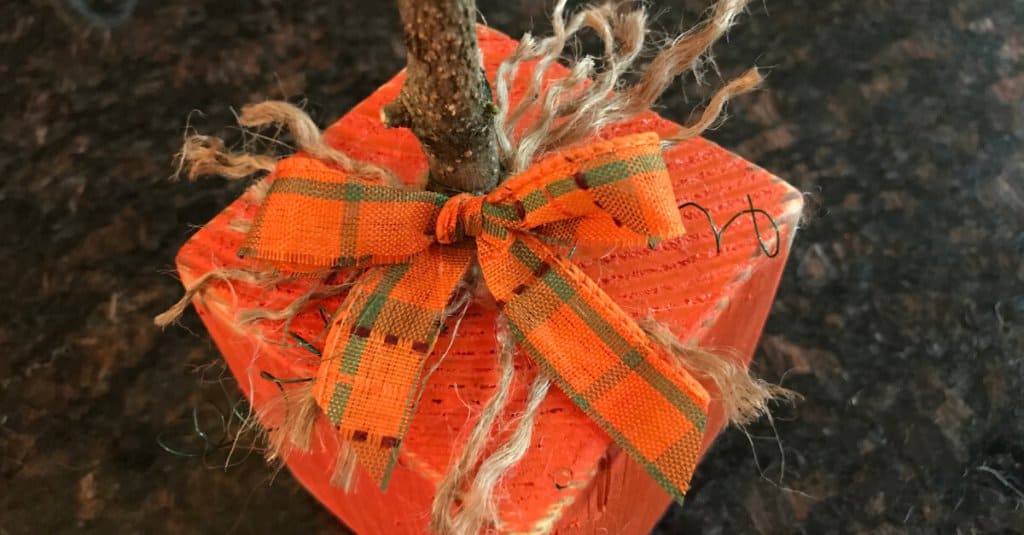 4 x 4 pumpkin with a festive bow.