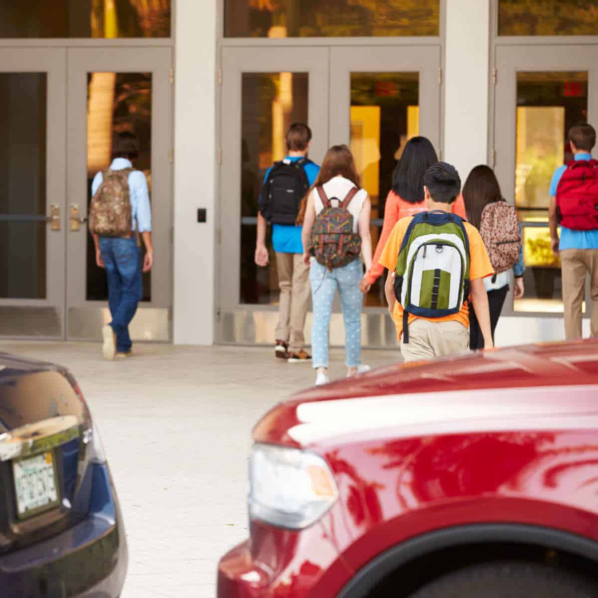 Middle school kids arriving at school.
