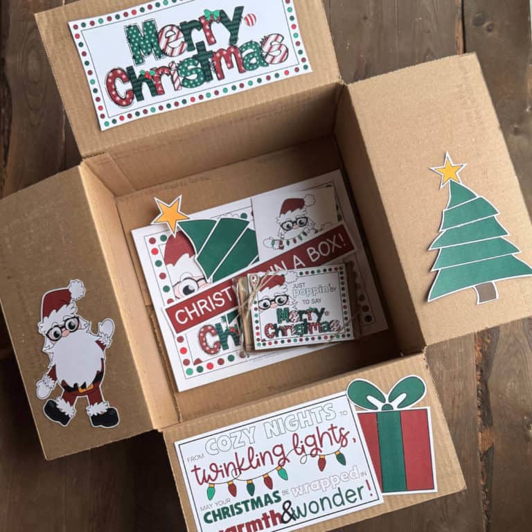 Image of a box with Christmas printables that have been cut to decorate the box flaps.