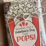 Bag of microwave popcorn with a tag on it that says Wishing You A Valentine's Day That Pops!
