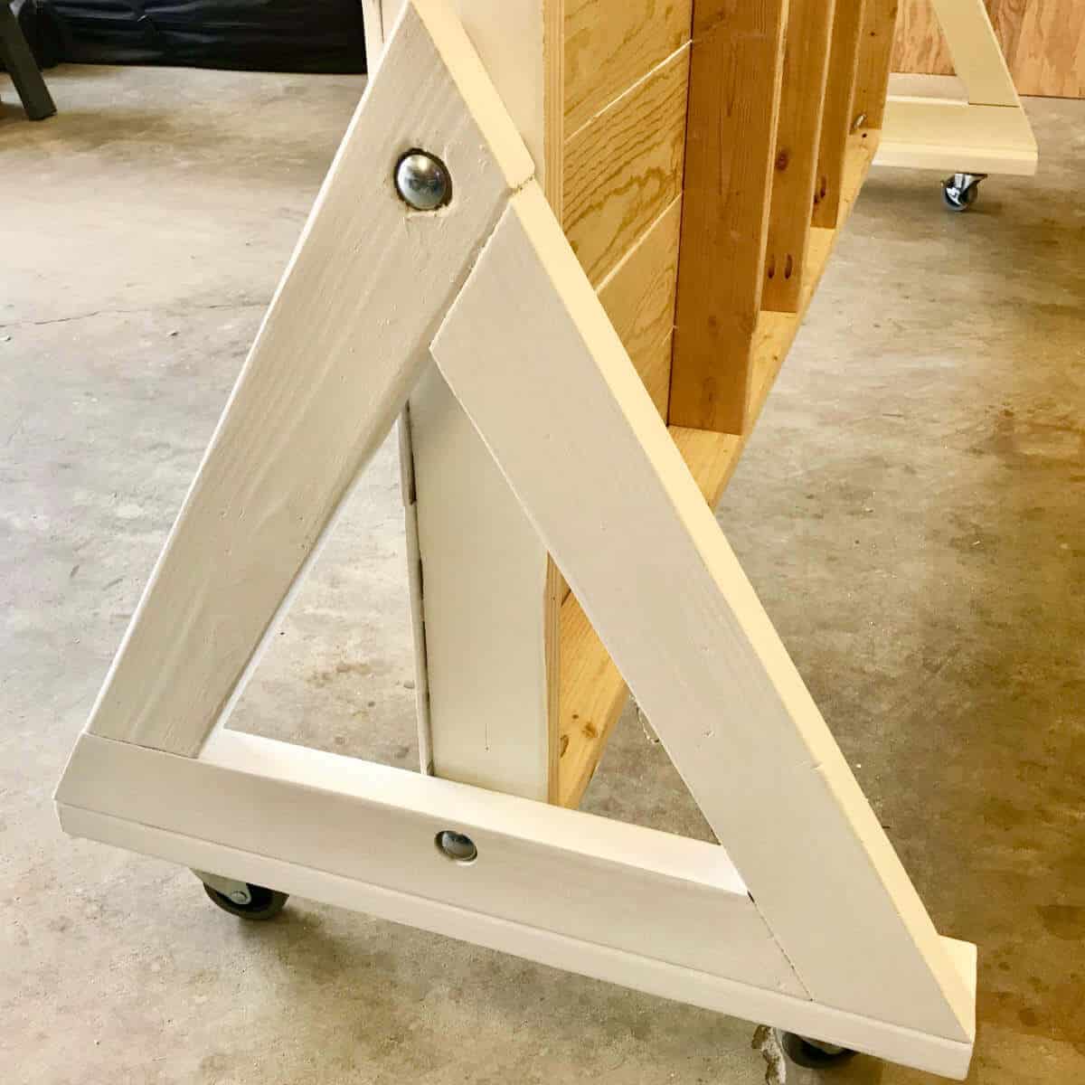 Triangle legs made out of wood for a photo backdrop wall.