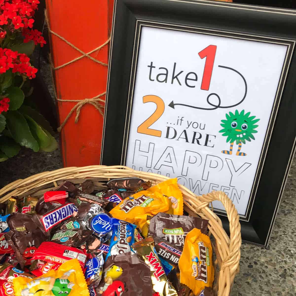 Take 1, 2 If You Dare printable sign next to a basket of candy.