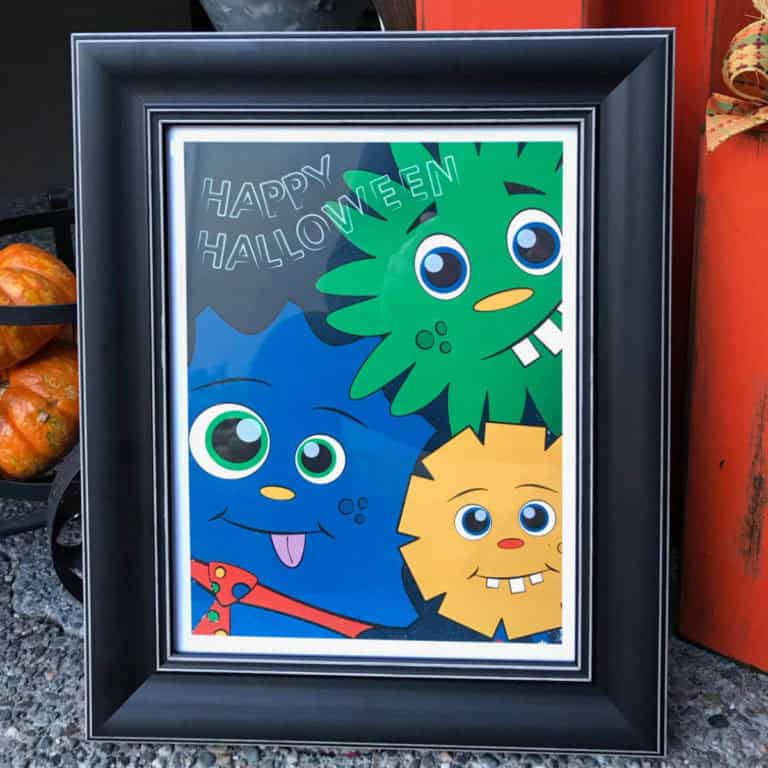 Printable Happy Halloween wall art with cute monsters on it.