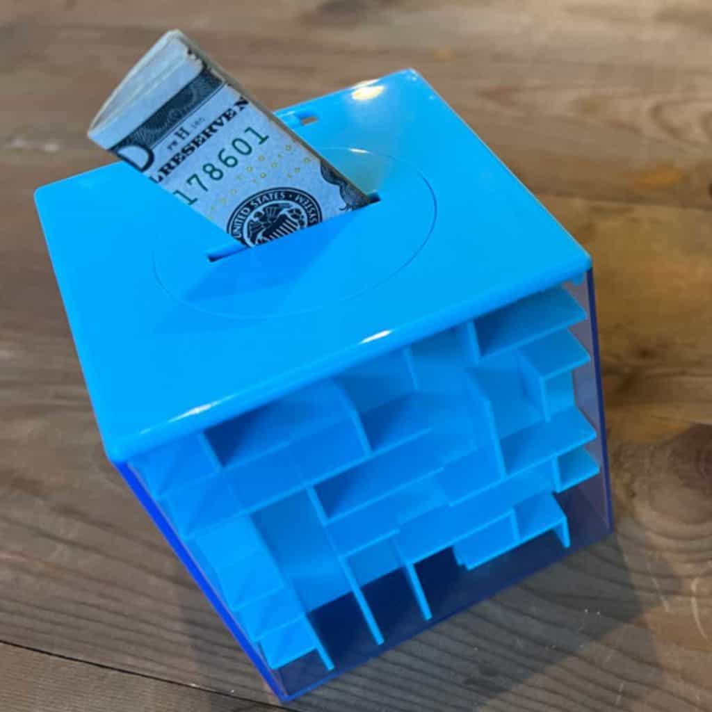 Maze cube with a compartment to hide something, like money, inside.