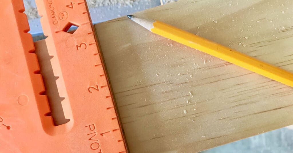 A square helps to draw a straight line on wood, for cutting.