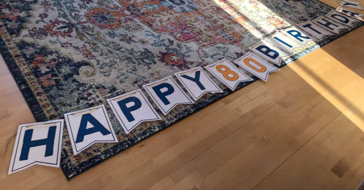 Happy Birthday Banner laid out on the floor, ready to be hung!