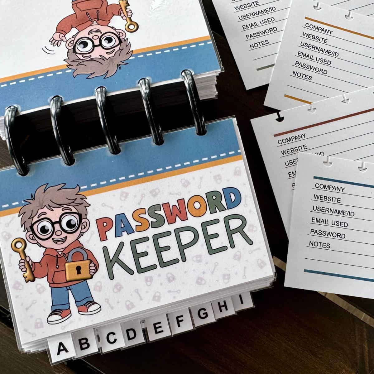Image of a discbound password keeper with a few blank password pages nearby.