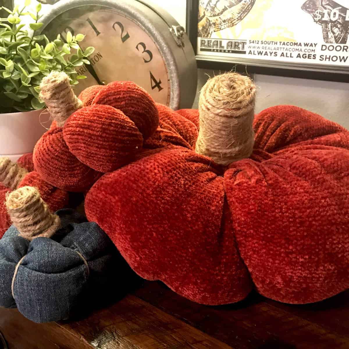 Two pumpkins made from an old sweater and one made out of jeans.