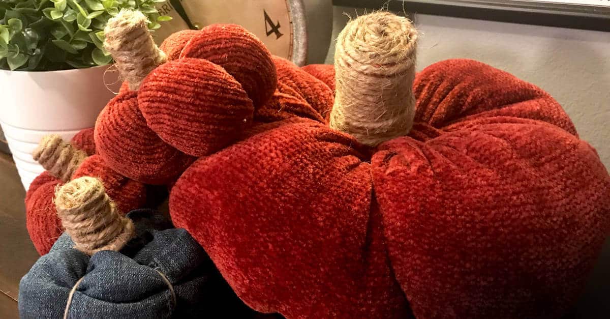 Two pumpkins made out of an old sweater and one pumpkin made out of jeans.