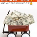 Wagon full of money with the words: What Is A Sinking Fund?