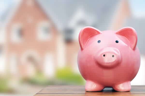 Piggy Bank with House in the background