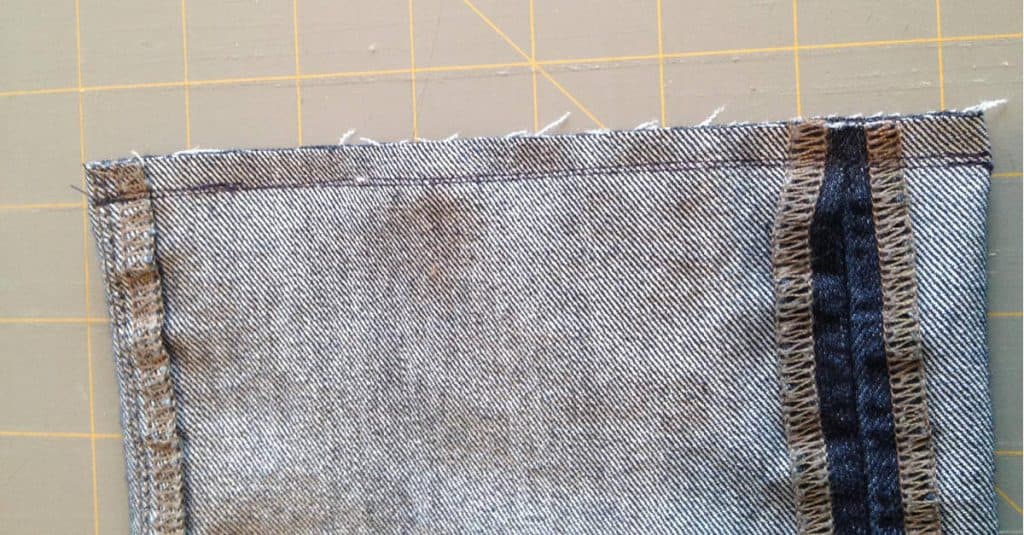 Old jean leg stitched closed at one end to make a flax seed heating bag.