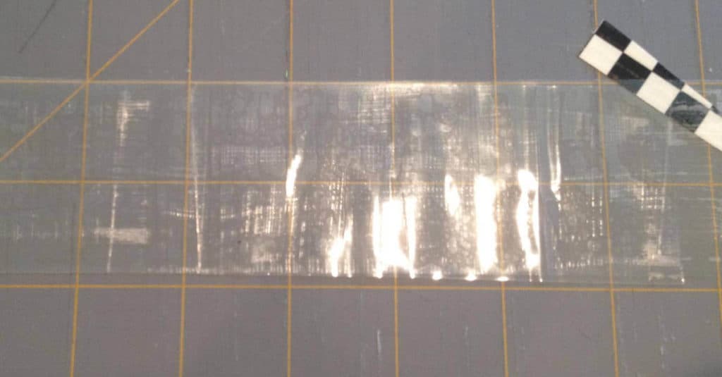 Create a clear pocket with packing tape.