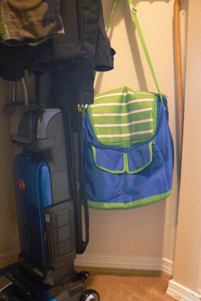 Vacuum cleaner and cooler bag, in the coat closet.