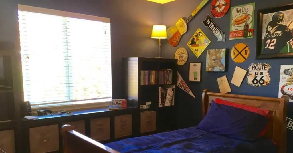 Tween boy's room with a wall of memorabilia.
