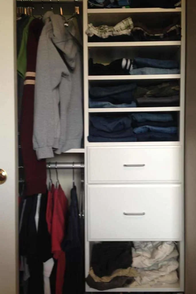 Tween boy's closet full of clothes.