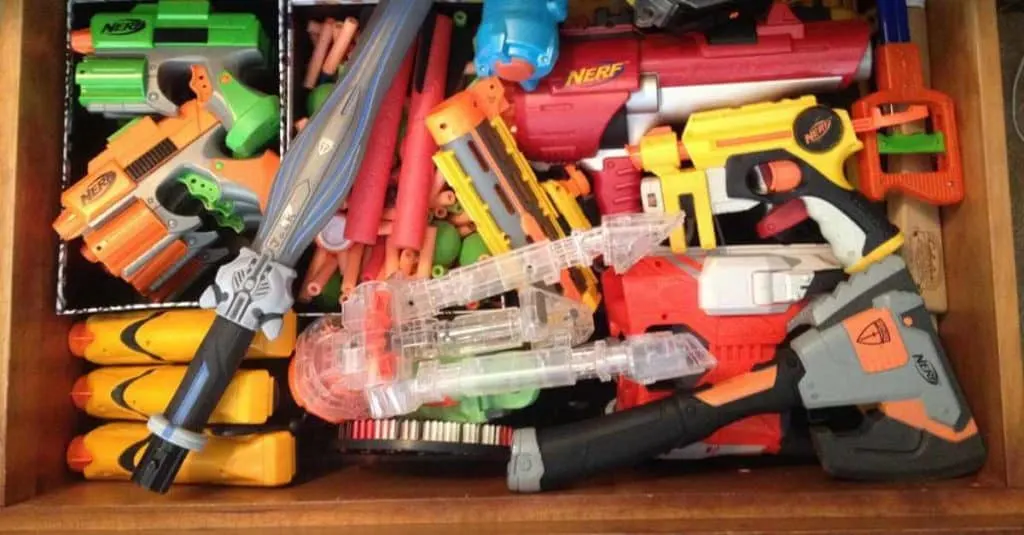 Nerf guns stored in an under the bed drawer.