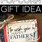 Just Poppin' By To Wish You A Happy Father's Day tag on a bag of microwave popcorn with the words, Father's Day Popcorn Gift Idea.