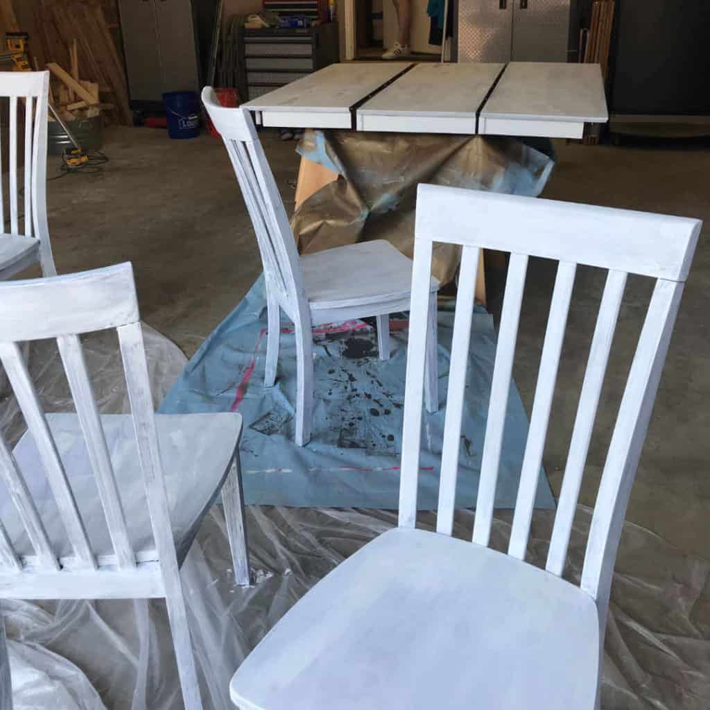 Table and chairs with primer painted on.