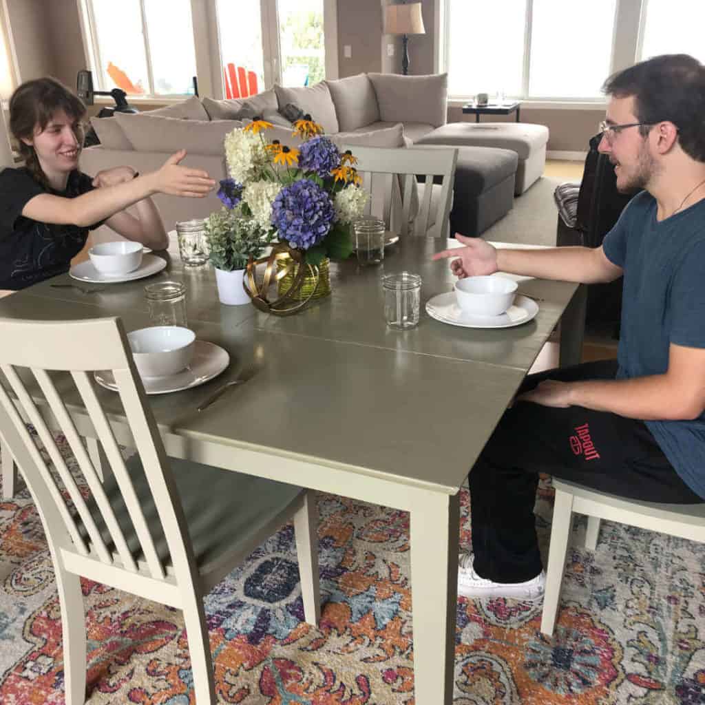 Justine and Colton sitting at the finished kitchen table!