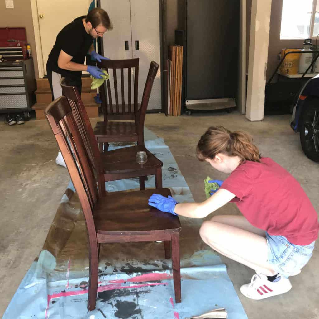 Wiping down chairs with Krud Kutter Gloss-Off.