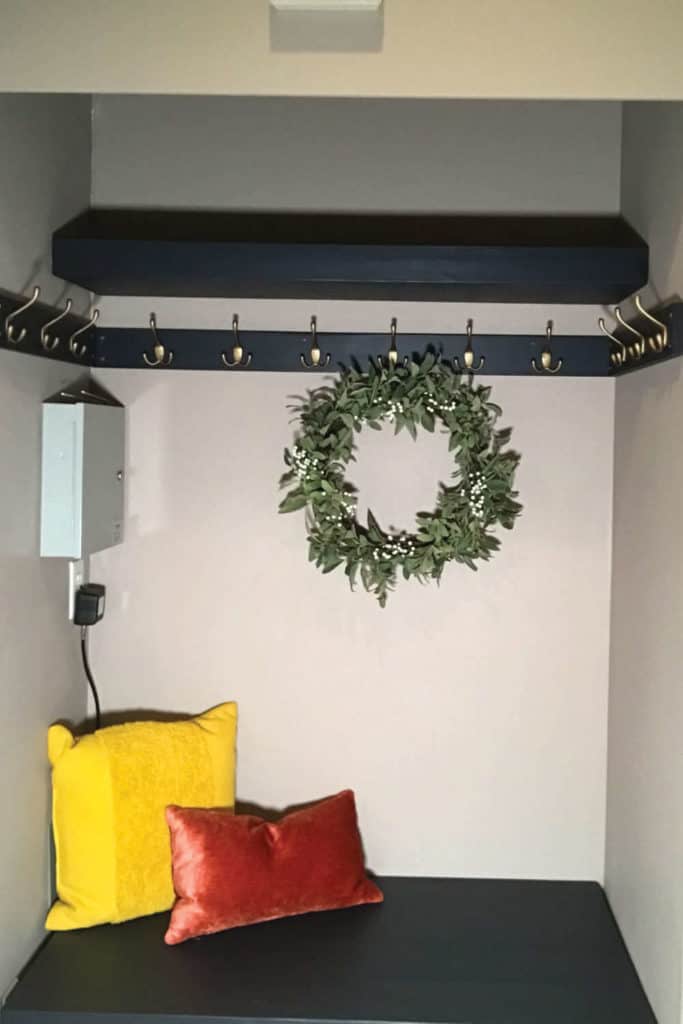 Coat closet converted to a mudroom.