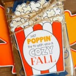 Printable fall popcorn tag on a bag of microwave popcorn and tied with jute.