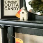 Sign that's framed and sitting on a mantel that says Straight Outta Candy.