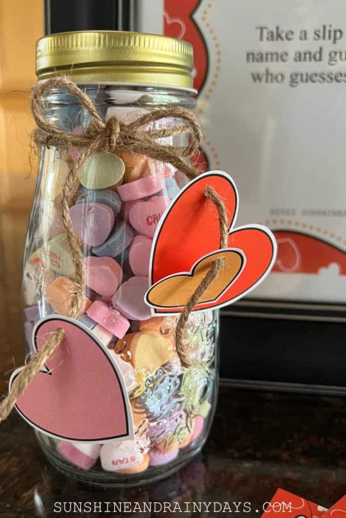 A jar filled with Conversation Hearts for Valentine's Day.