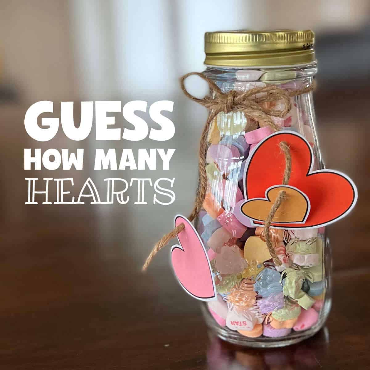 Conversation hearts in a jar with clip art hearts hanging from the jar.