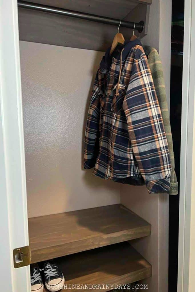 Small Closet with closet rod and shelving.