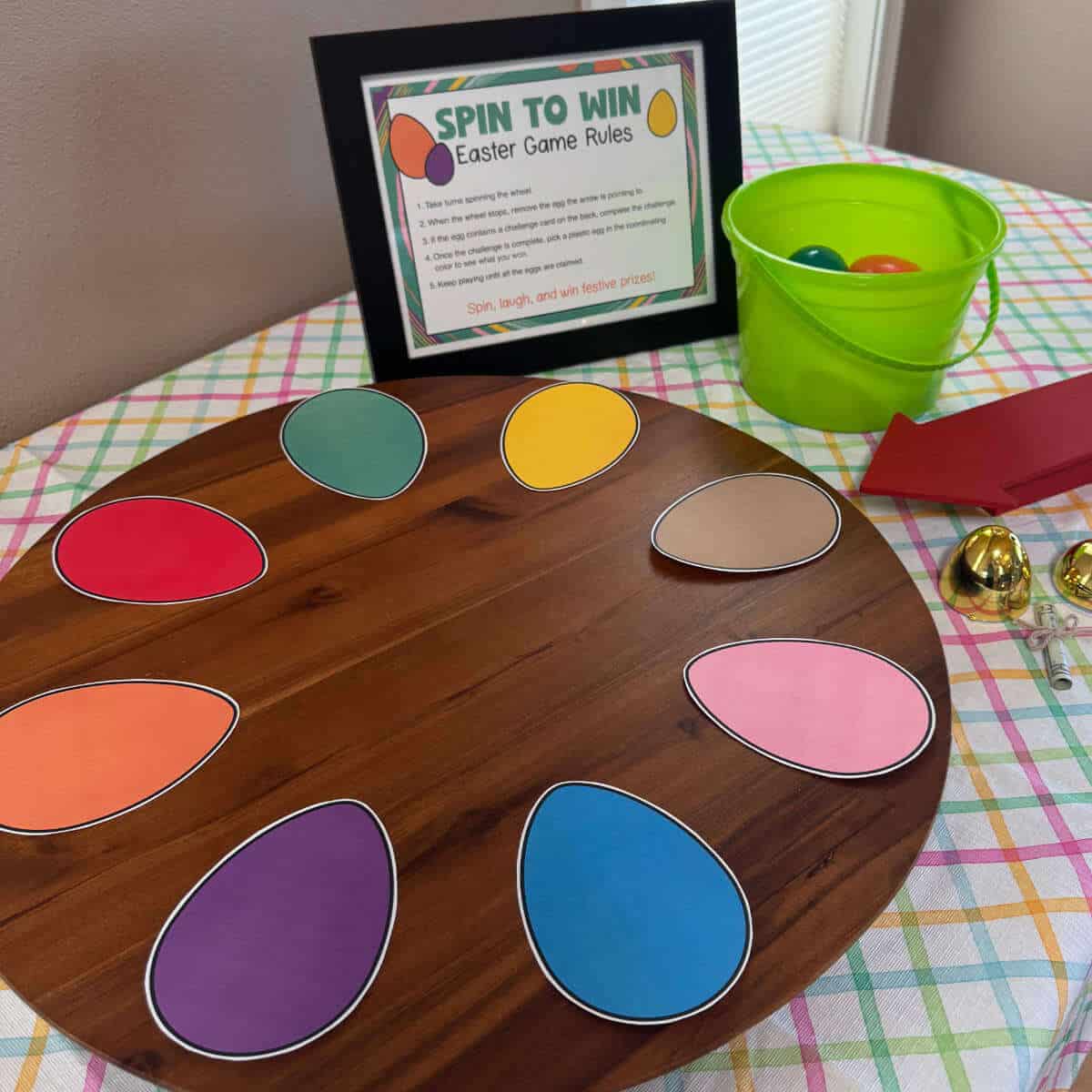 Printable Easter eggs on a lazy Susan with a Spin To Win sign next to it.