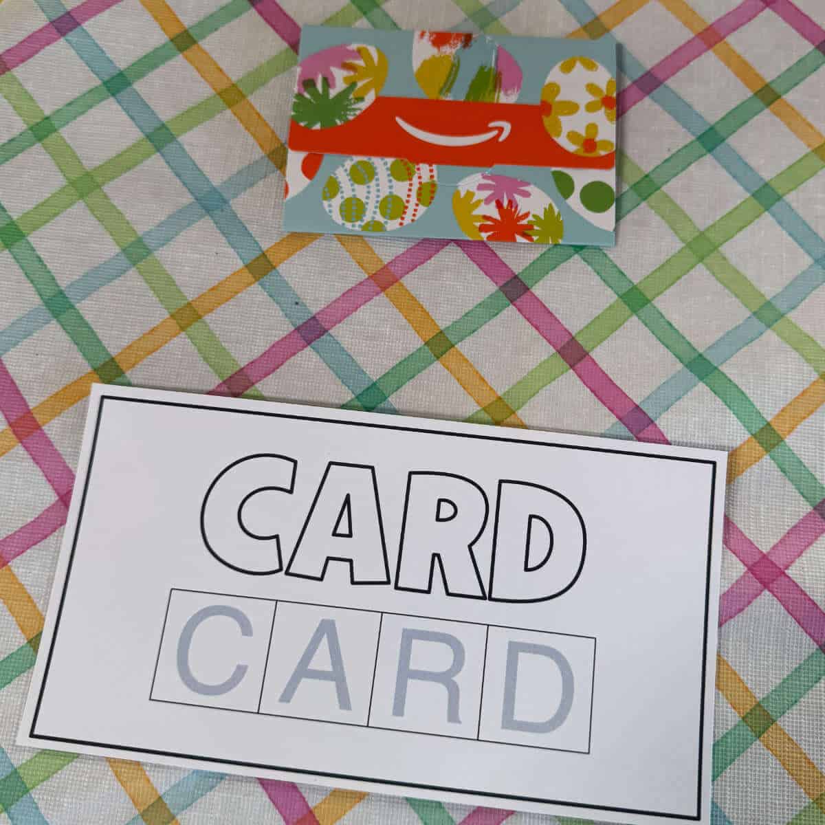Printable Sheet that says card twice with an Amazon gift card beside it for an Egg Scramble Easter party game.