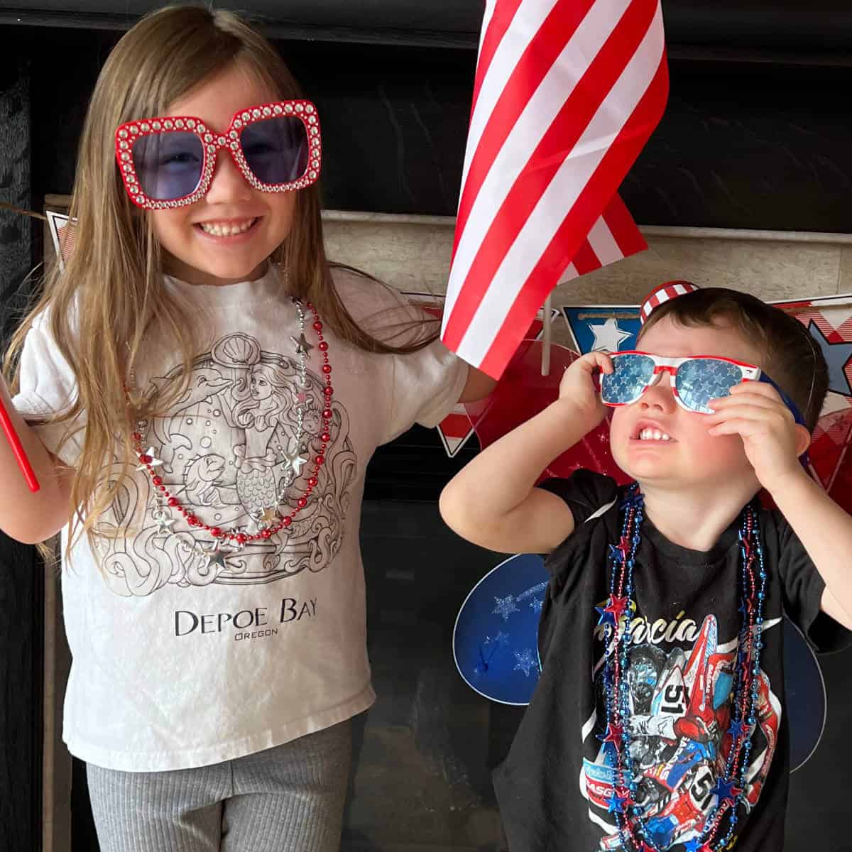 A boy and girl decked out in 4th of July gear.