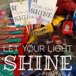 Let Your Light Shine tags on glow sticks that are in a Halloween trick-or-treat basket.