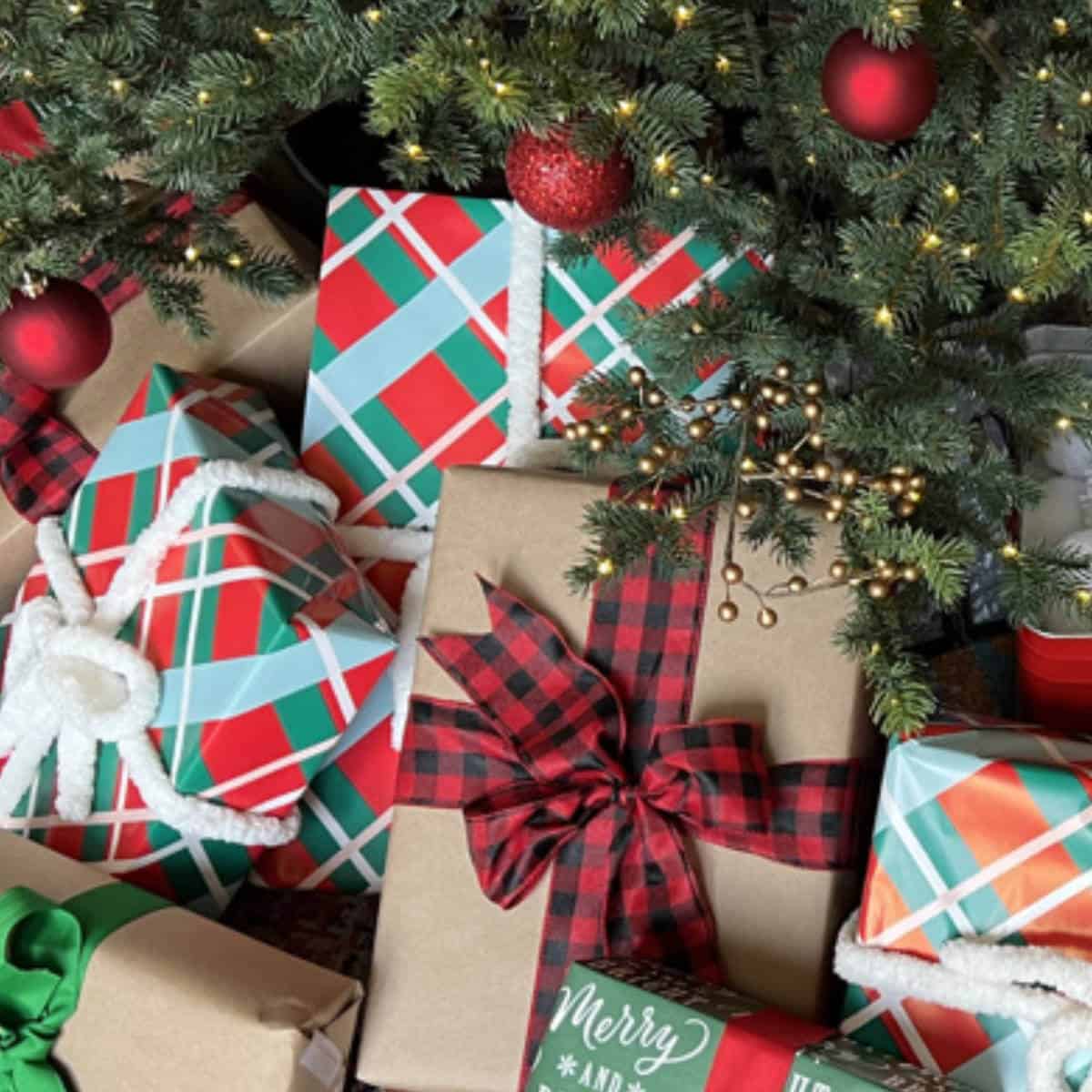 Image of wrapped gifts under a Christmas tree.