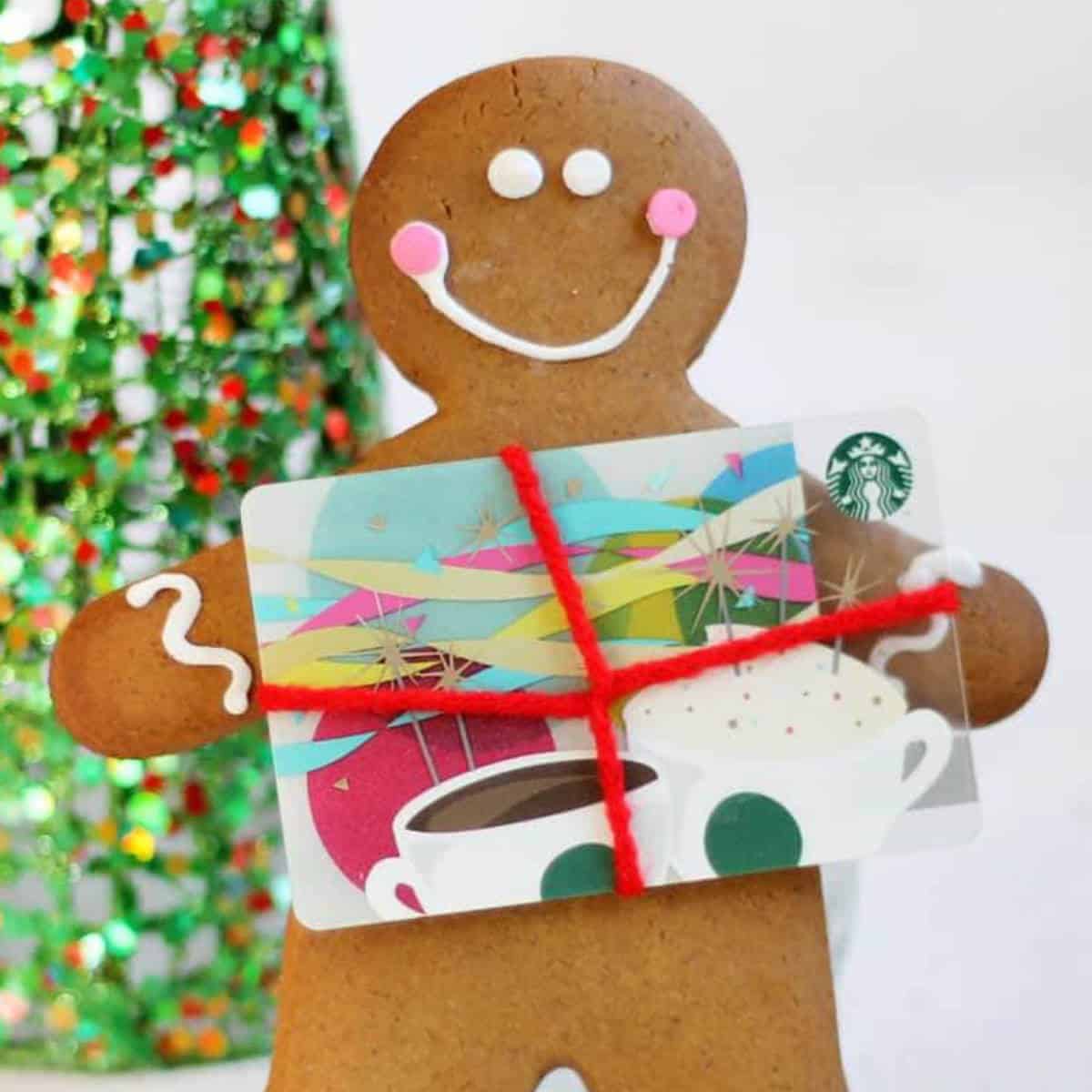 Gingerbread man cookie with a gift card.