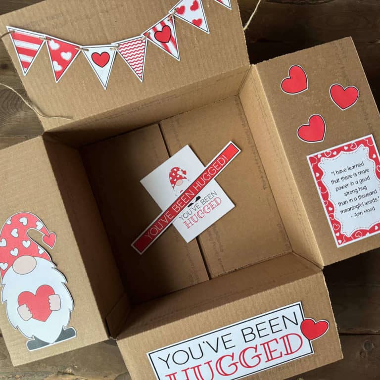 Care package box with printable decor on the box flaps with a You've Been Hugged theme.