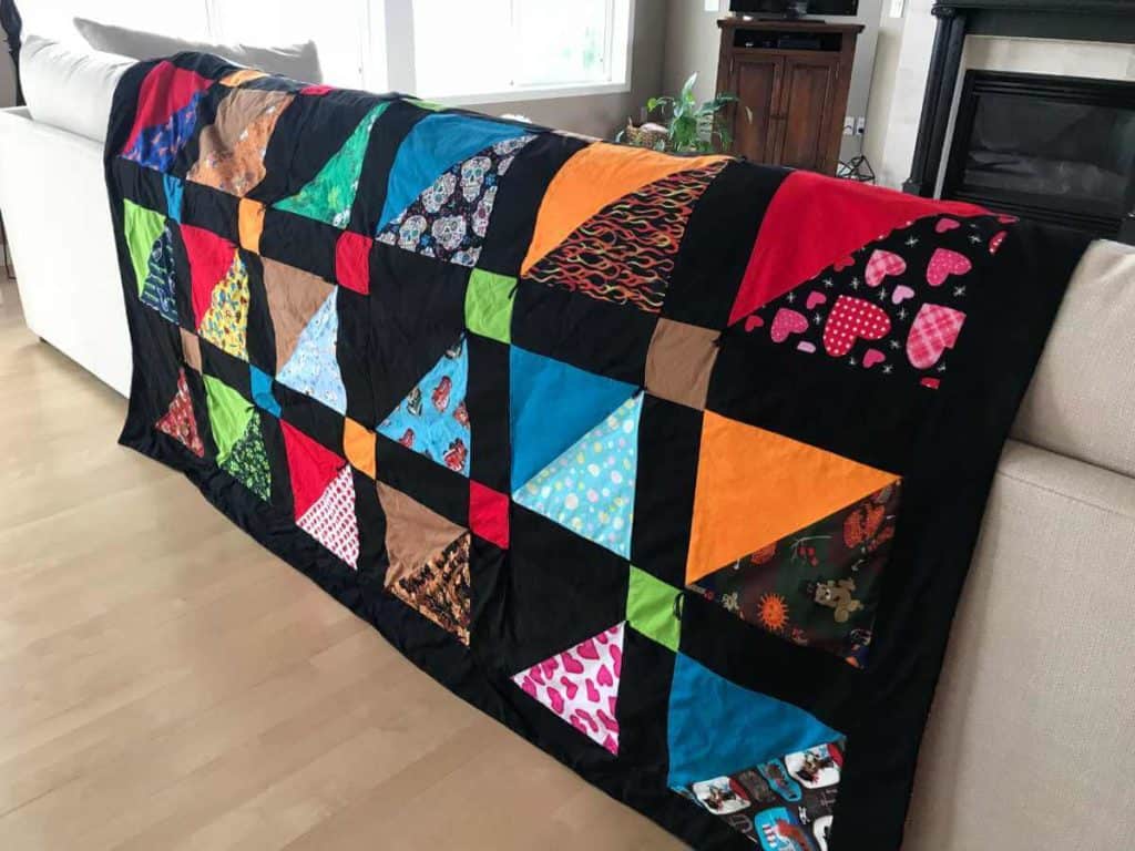 Finished quilt made out of dog bandanas.