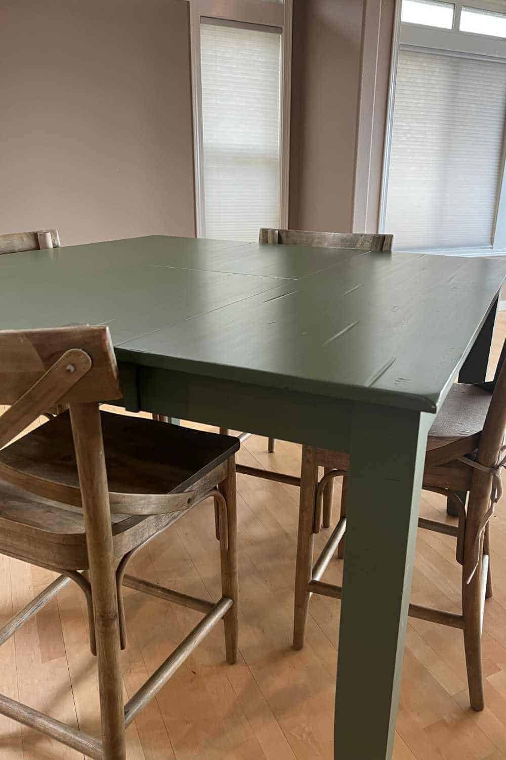 Kitchen table that has been painted with Fusion Mineral Paint in the color Bayberry and the top finished with a water-based polyurethane.