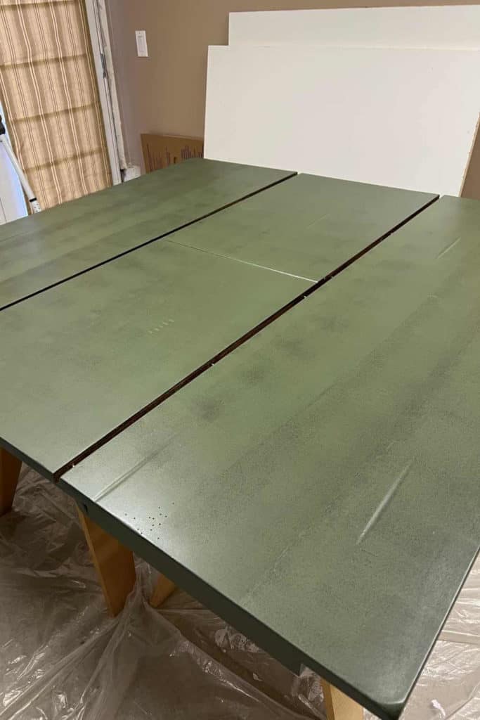Painting a kitchen table with Fusion Mineral Paint in the color Bayberry.