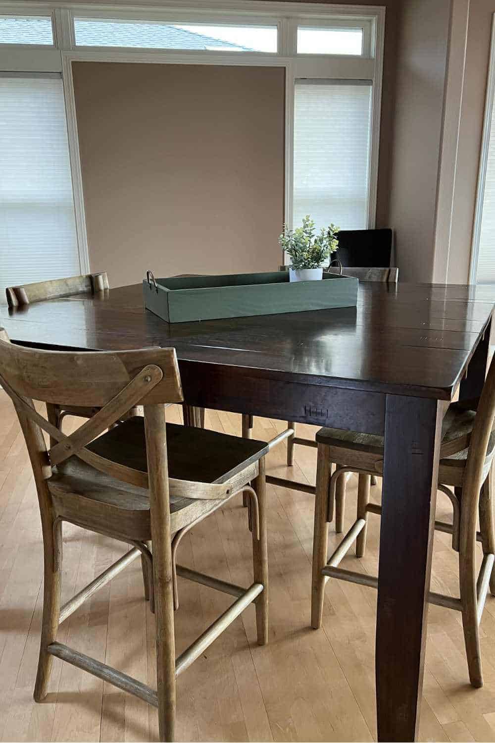 Counter height table with barstools that don't match.