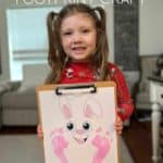 Easter Bunny Footprint Craft printable with little girls feet stamped on with pink paint.