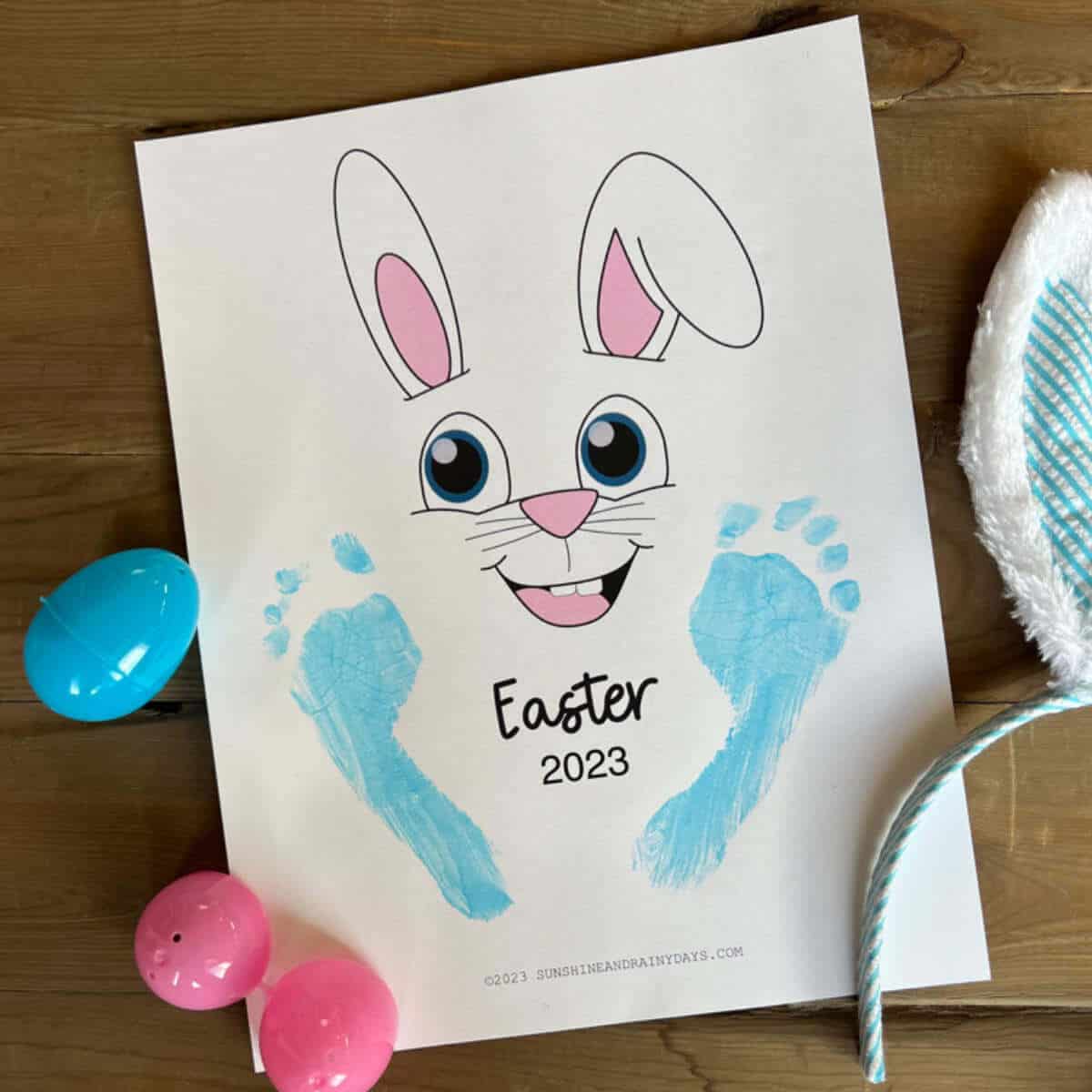 Blue footprints on a printable page with an Easter bunny face.