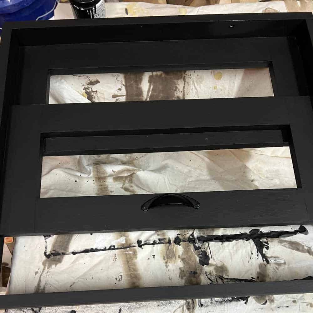 Painting a fake window frame.